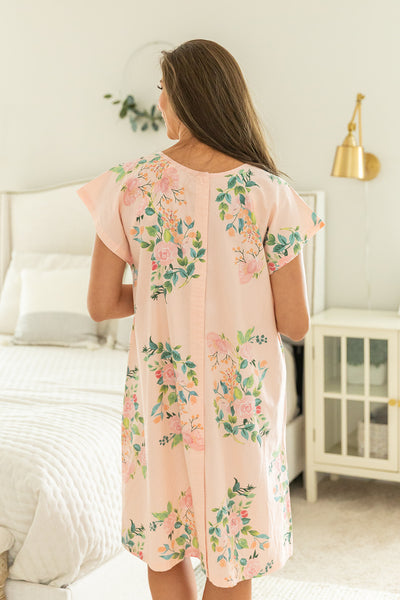 hospital gown with snaps down the back and off should to avoid unnecessary flashing 
