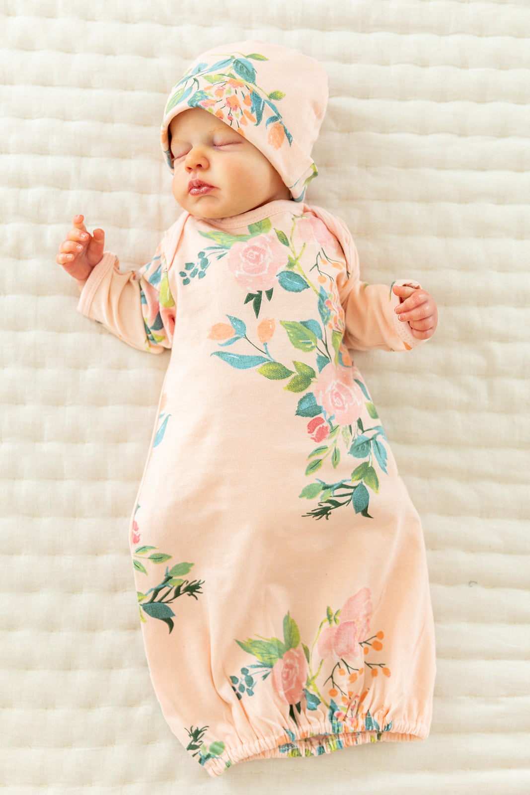 floral baby gown with fold over mitts and matching hat, elastic bottom for easy diaper change. Also available matching pjs for big sister, beautiful baby shower gift